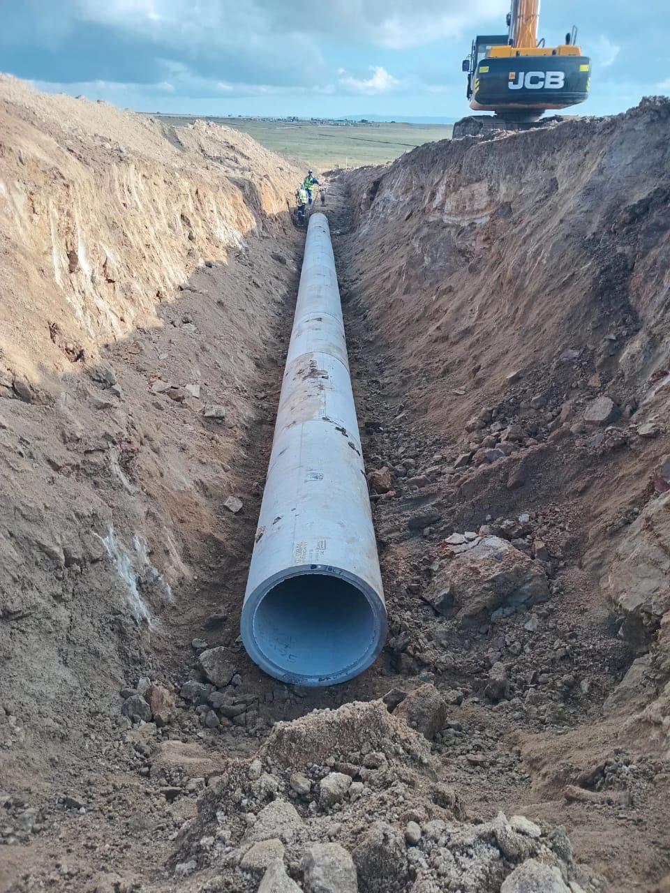 Large diameter concrete pipe laid inside a deep excavated trench for bulk stormwater infrastructure
